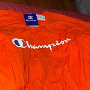 Orange champion T. L. Never worn. Tags on